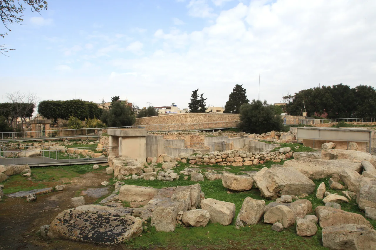 Megalithic temple ruins at Tarxien built from upright limestone slabs and coursed blocks