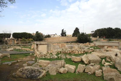 Megalithic temple ruins at Tarxien built from upright limestone slabs and coursed blocks