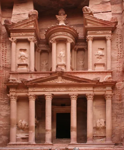The Corinthian-columned facade of Al-Khazneh carved into the sandstone cliff at Petra