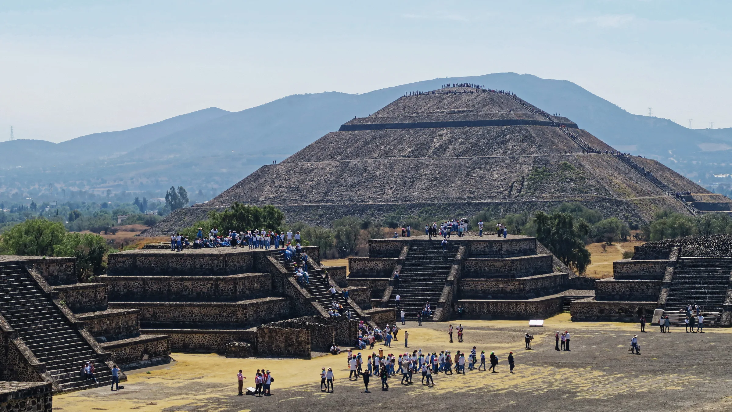The Avenue of the Dead at Teotihuacan with the stepped, sloped-and-panelled Pyramid of the Sun behind