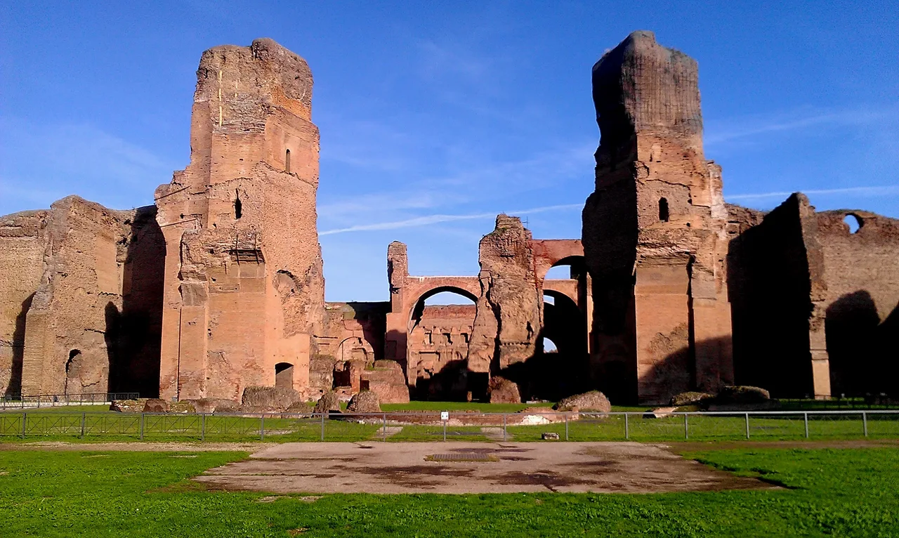 The towering brick-and-concrete wall ruins and great vaulted spans of the Baths of Caracalla