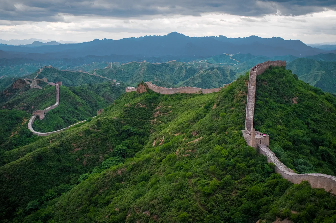 A stone- and brick-faced section of the Great Wall running along the mountain ridges at Jinshanling