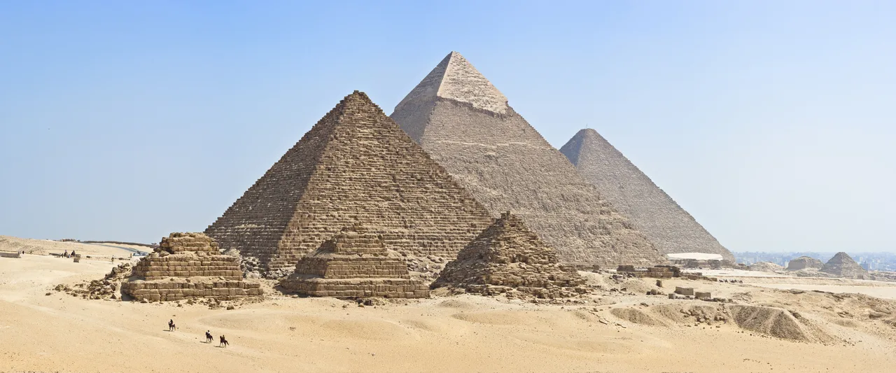 The three great pyramids of Giza standing on the desert plateau