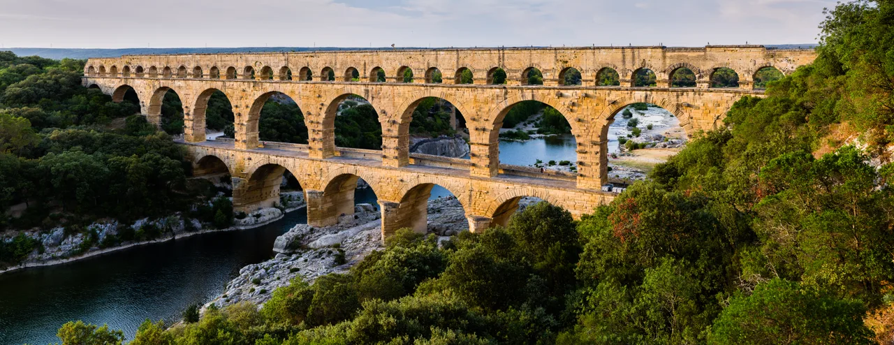 The Pont du Gard aqueduct of three tiers of arches spanning the Gardon river
