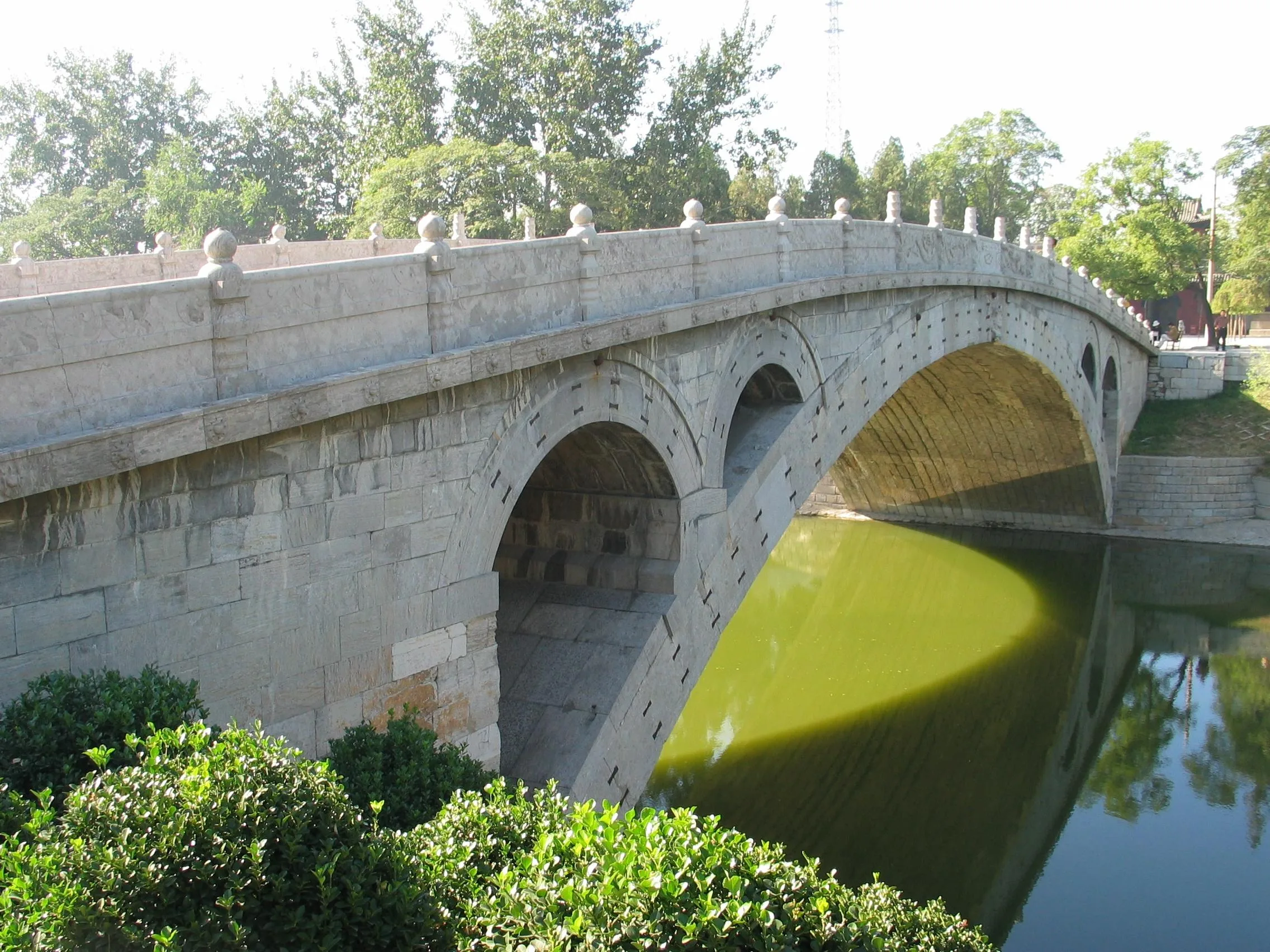 The flattened stone arch of the Anji (Zhaozhou) Bridge with the small arches in its spandrels