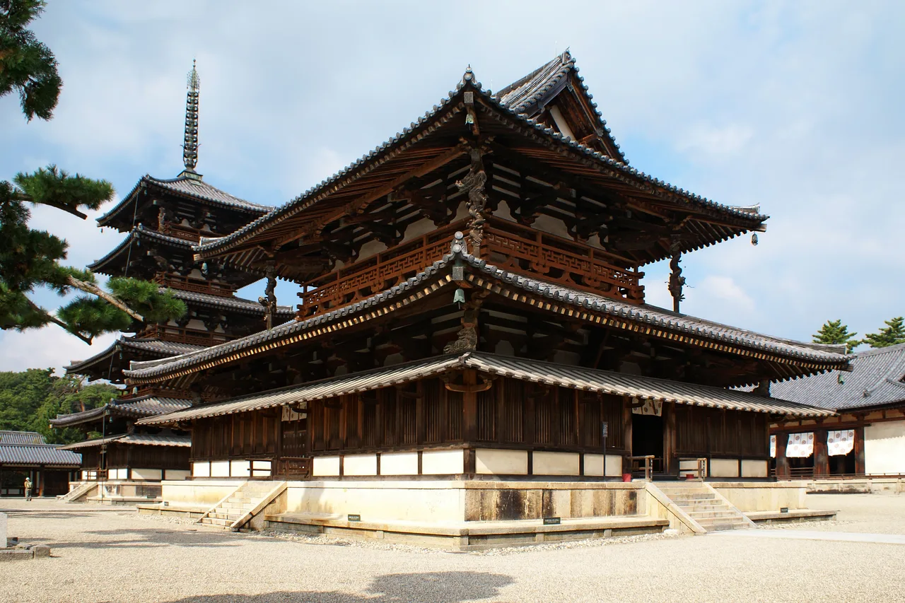 The five-storey wooden pagoda of Hōryū-ji and the adjacent kondō (golden hall) on a gravel courtyard