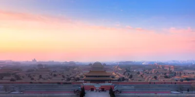 The axially arranged courtyards and broad-eaved roofs of the Forbidden City seen from Coal Hill