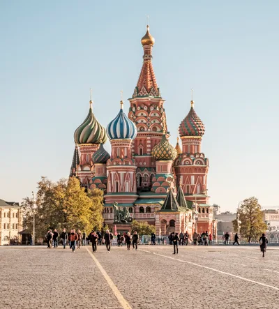 The chapels of Saint Basil's Cathedral clustered on one base, with onion domes of different colours and forms