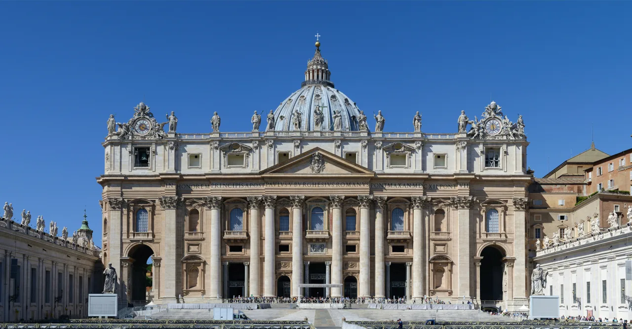 The main facade of St. Peter's Basilica and the ribbed dome behind it