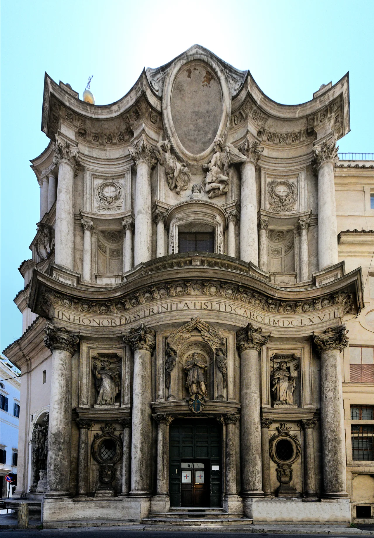 Borromini's façade for San Carlo: a sculptural stone surface undulating in a concave-convex rhythm with rows of columns