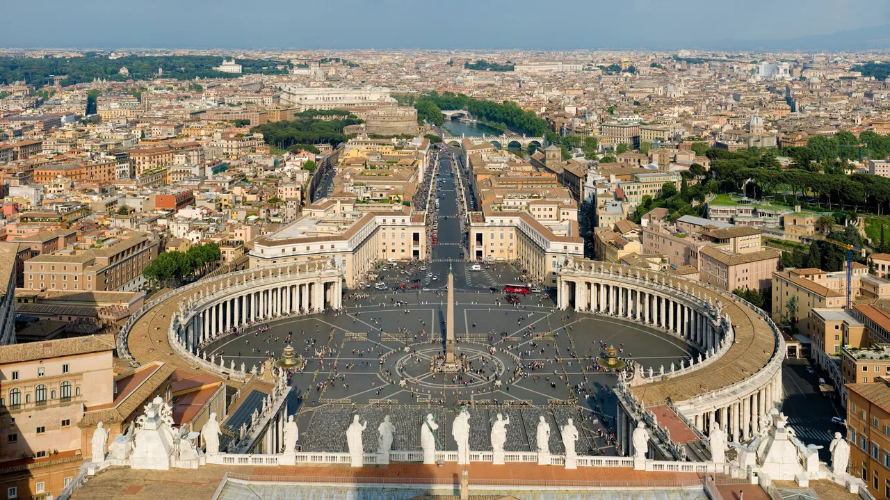 The elliptical double colonnade embracing St Peter's Square with the central obelisk; the basilica's dome behind