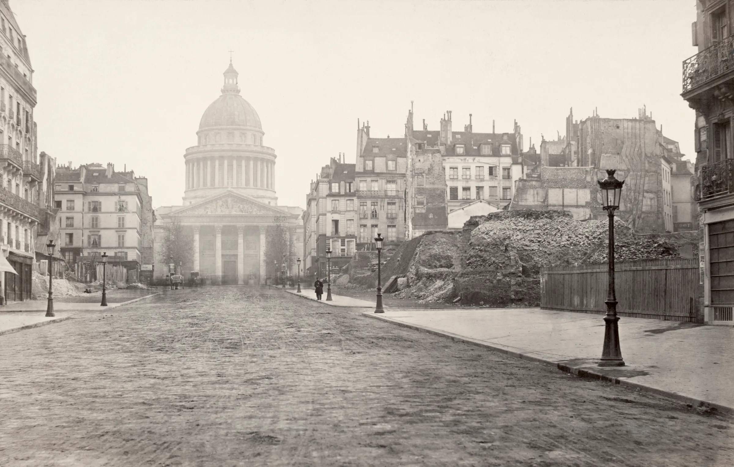 Rue Soufflot during demolition: sheared building walls, rubble, and the dome of the Panthéon behind