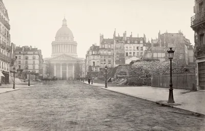 Rue Soufflot during demolition: sheared building walls, rubble, and the dome of the Panthéon behind