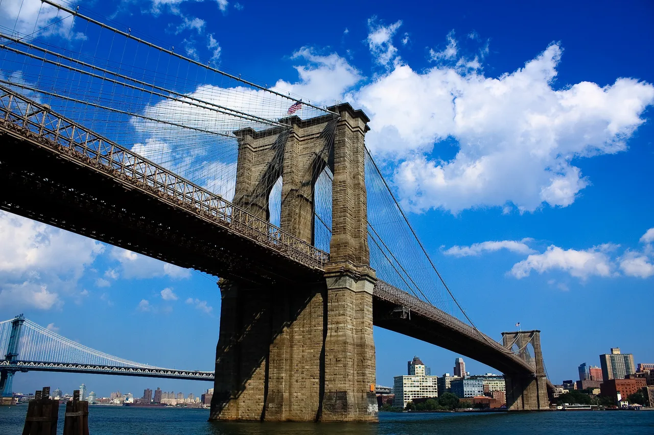 The Neo-Gothic stone towers and steel cables of the Brooklyn Bridge