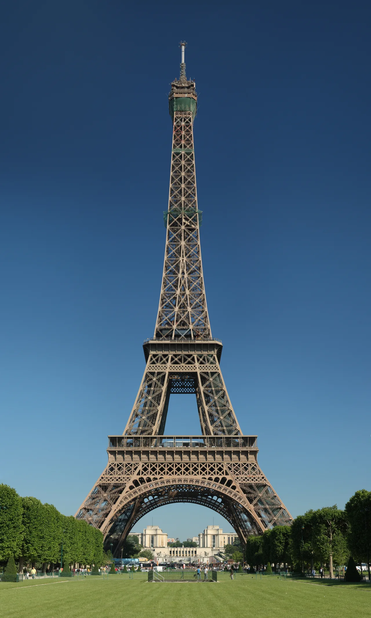 The open lattice-textured wrought-iron structure of the Eiffel Tower