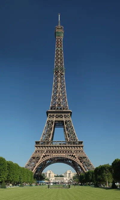 The open lattice-textured wrought-iron structure of the Eiffel Tower