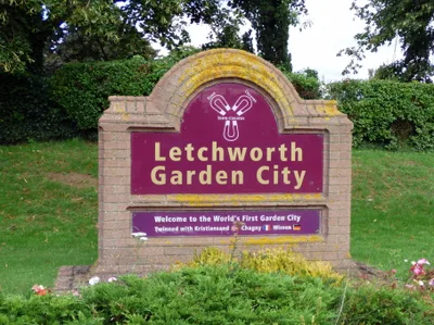 Low houses and tree-lined roads among wide green spaces in Letchworth Garden City