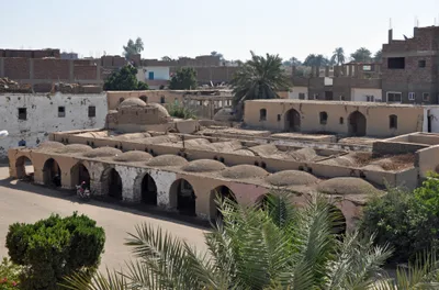 Mud-brick buildings at New Gourna: domed roofs, arched openings and earth-coloured walls