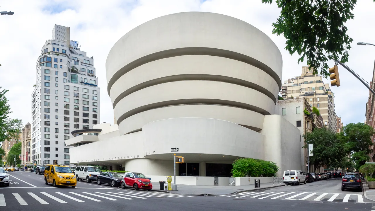 The upward-widening, white, helical reinforced-concrete exterior mass of the Guggenheim Museum