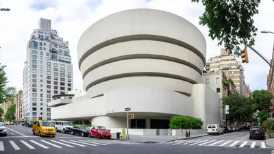 The upward-widening, white, helical reinforced-concrete exterior mass of the Guggenheim Museum