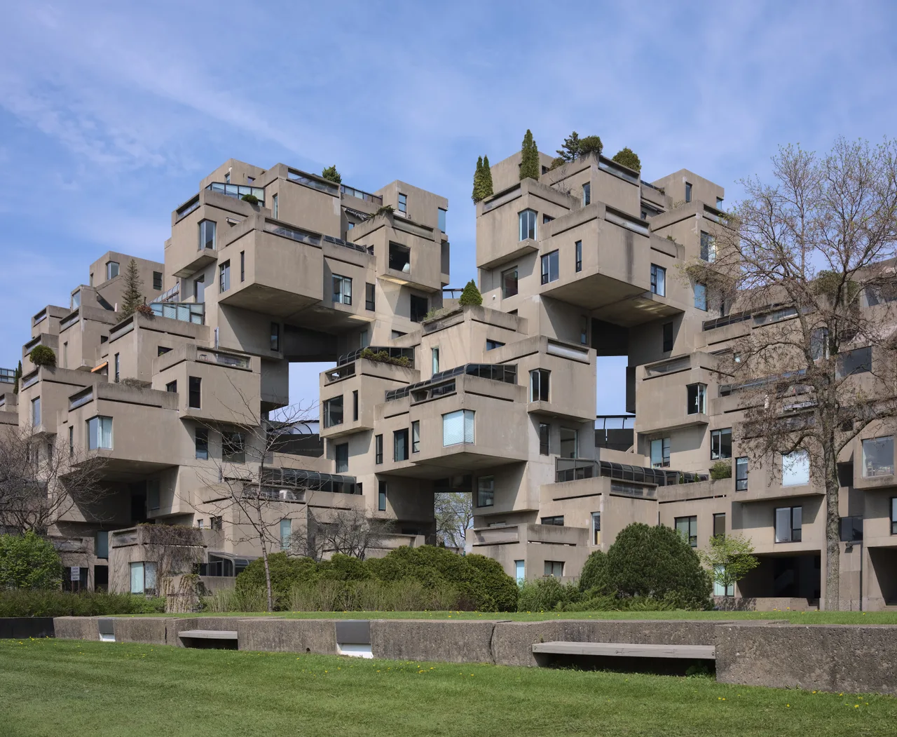 The prefabricated concrete box modules of Habitat 67, stacked with a shift, each with a terrace
