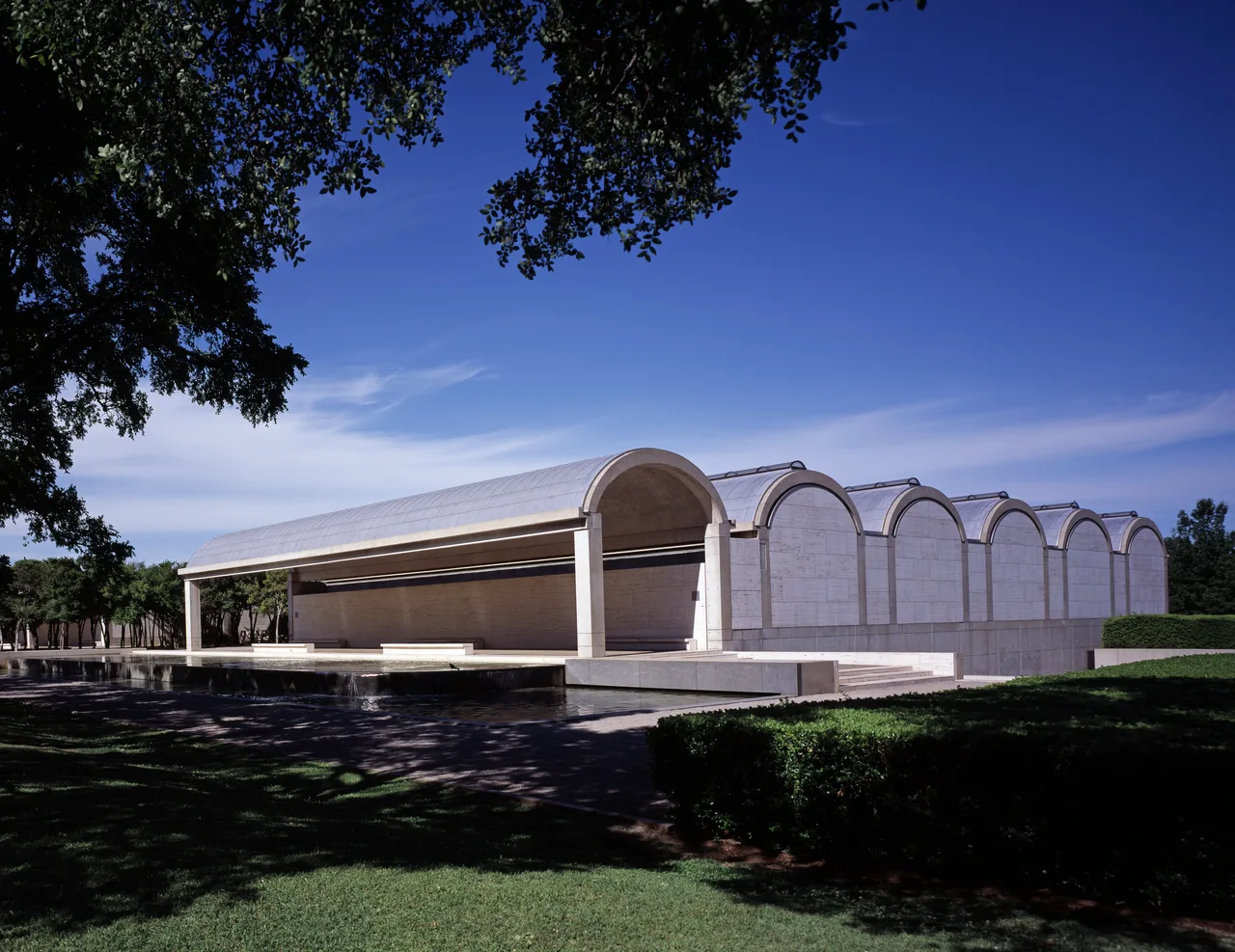 The low, repeated cycloid reinforced-concrete vaults and travertine façade of the Kimbell Art Museum