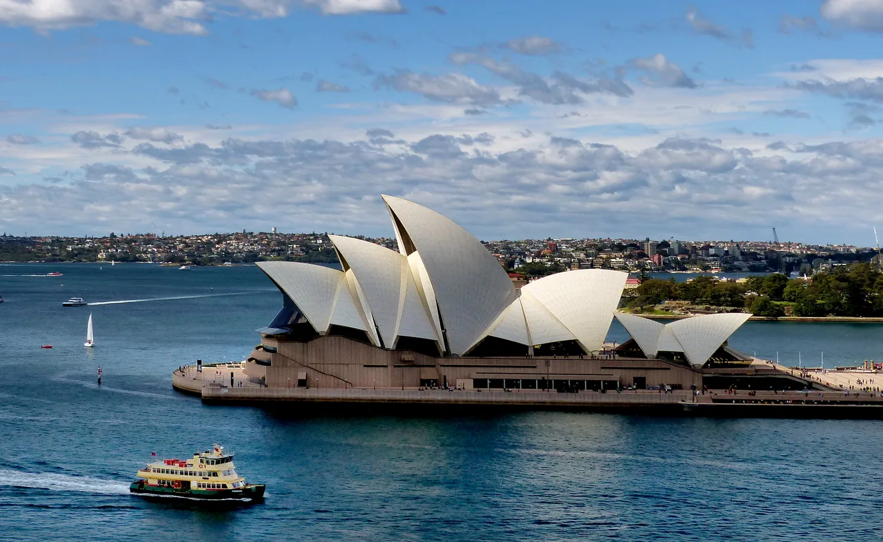 The white shell sails of the Sydney Opera House rising over the harbour