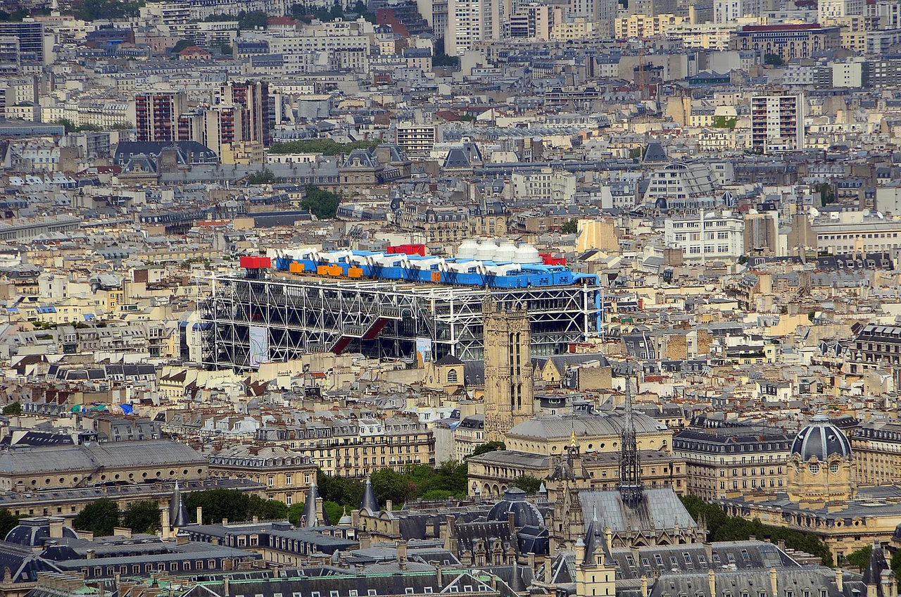 The exterior steel structure, coloured pipes, and glass-tube escalator of the Centre Pompidou