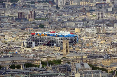 The exterior steel structure, coloured pipes, and glass-tube escalator of the Centre Pompidou