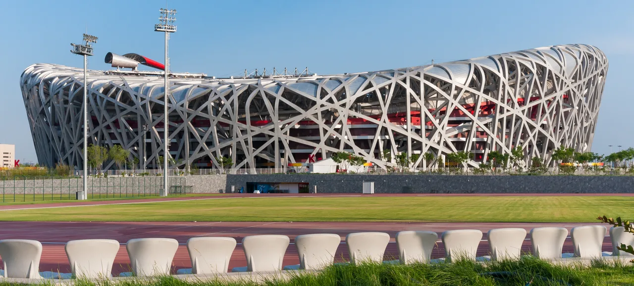 The net of giant steel girders of the Beijing National Stadium, crossing over one another in an irregular weave