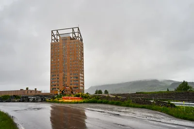 The timber skyscraper Mjøstårnet rising by Lake Mjøsa