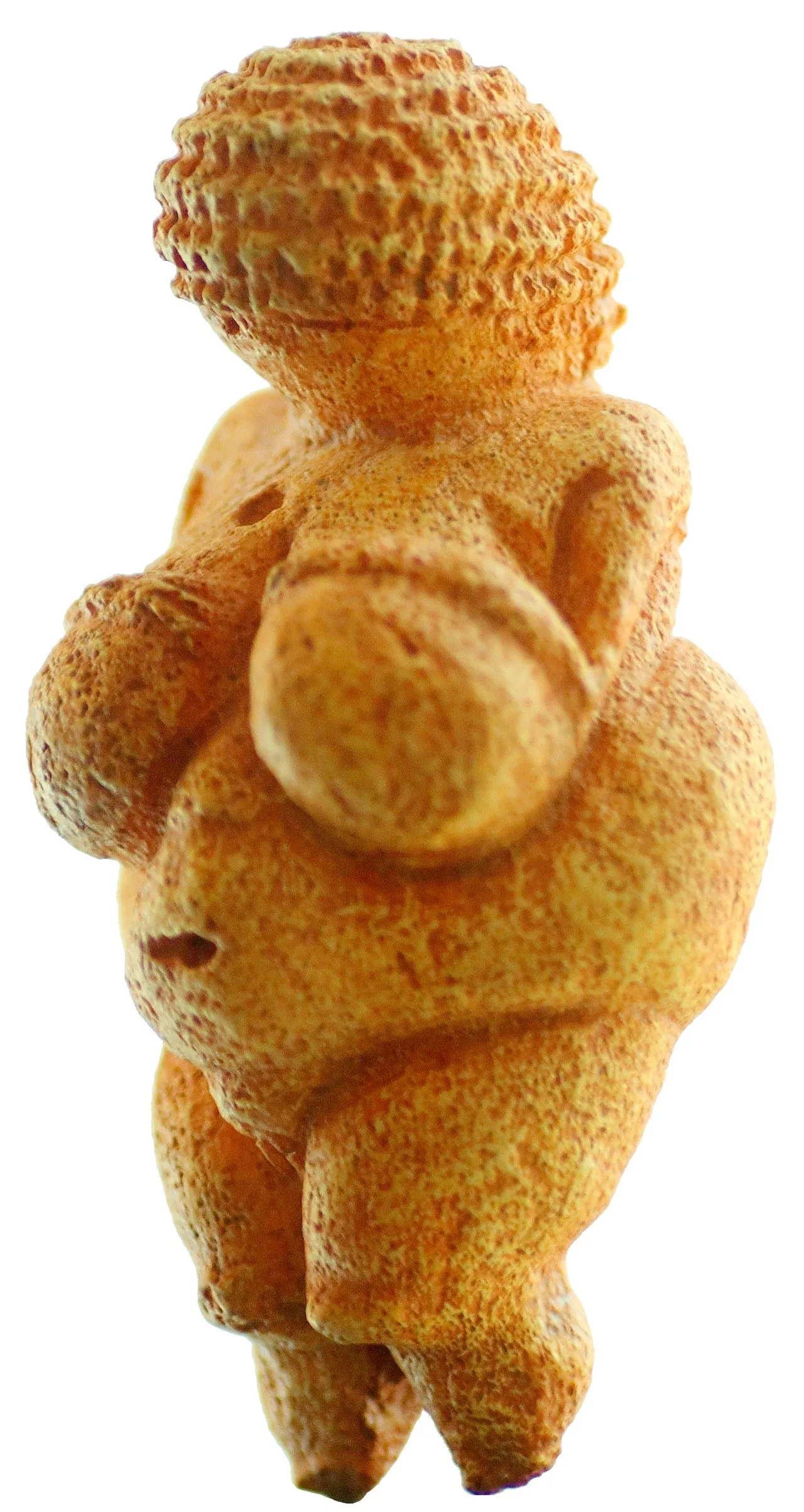 Small female figurine of oolitic limestone with pronounced breasts, broad hips, and what appears to be a braided head covering