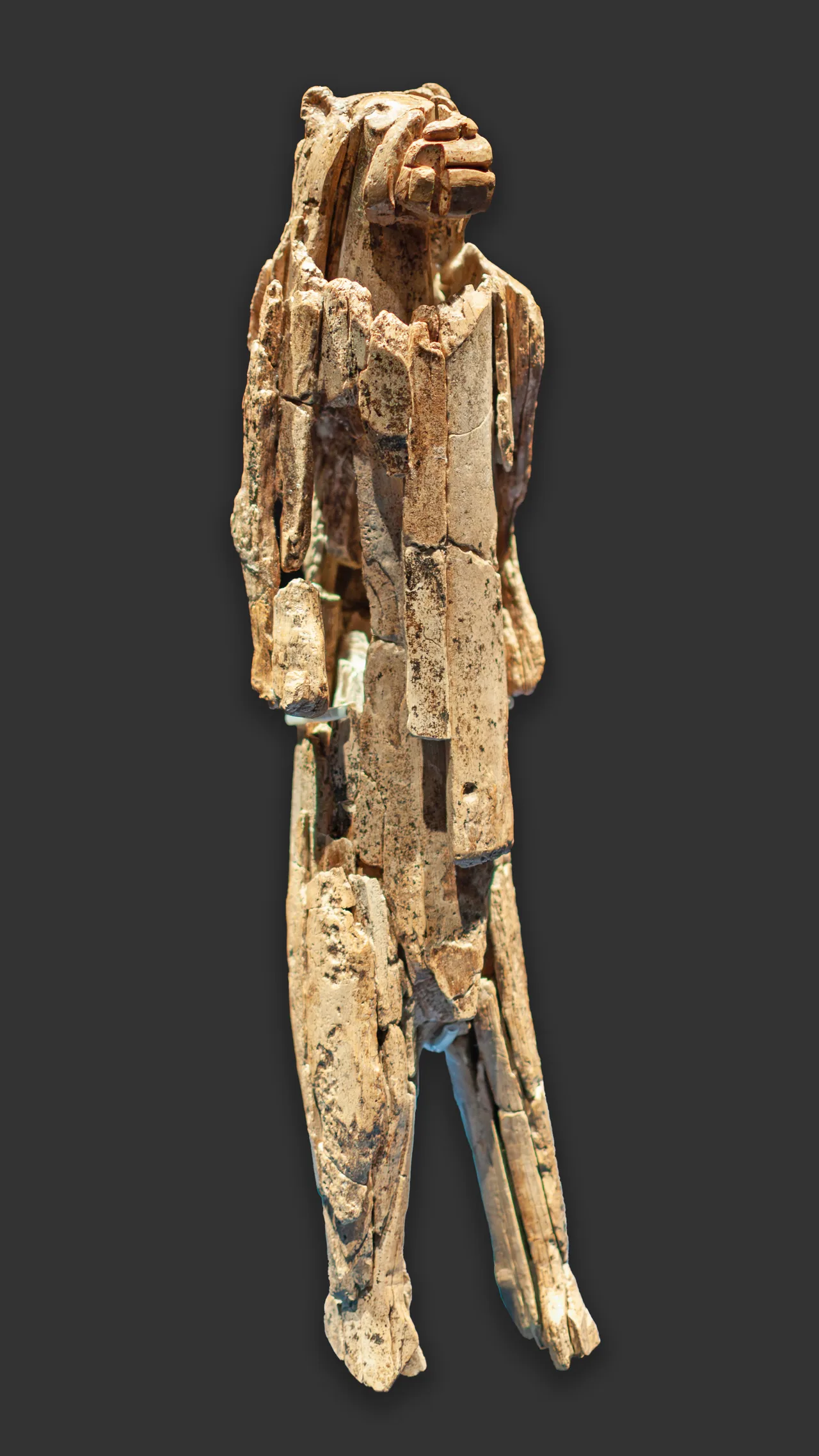 Standing figurine with a human body and a lion's head, carved from mammoth ivory