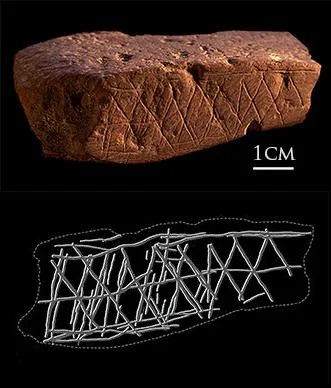 A piece of red ochre engraved with cross-hatched geometric lines found at Blombos Cave