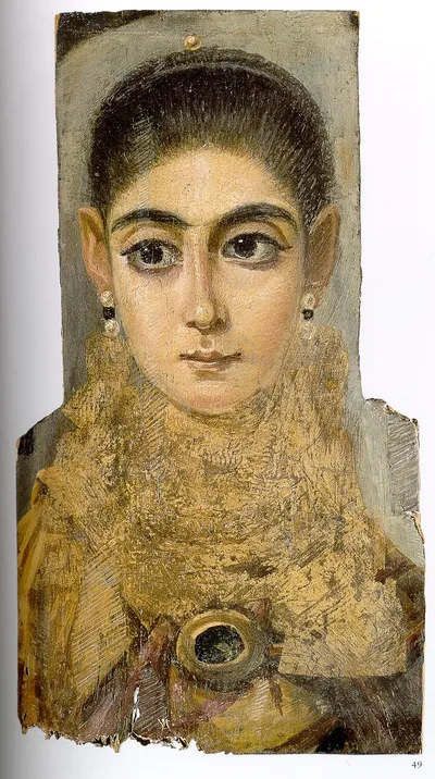 A Fayum mummy portrait: a realistic painted face of a young person with large dark eyes and curly hair on a wooden panel