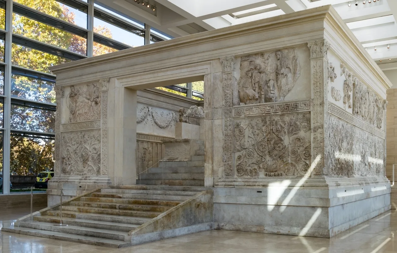 The reconstructed marble Ara Pacis altar displayed inside its museum pavilion