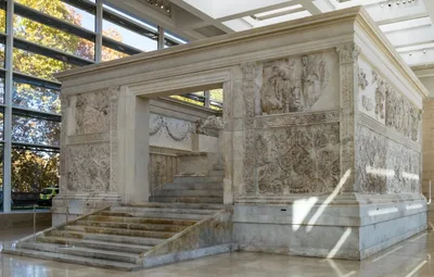 The reconstructed marble Ara Pacis altar displayed inside its museum pavilion