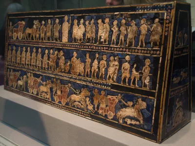 The 'Peace' side of the Standard of Ur: figures arrayed in three registers in shell, lapis lazuli, and limestone inlay