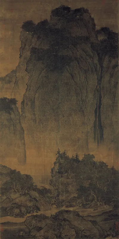 Fan Kuan's hanging scroll on silk: a vast sheer mountain filling two-thirds of the painting, a thin waterfall on the right, and a tiny mule train at its foot