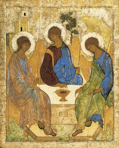 Rublev's Trinity icon: three angels seated around a table with heads slightly bowed; a golden ground, soft blue and gold tones