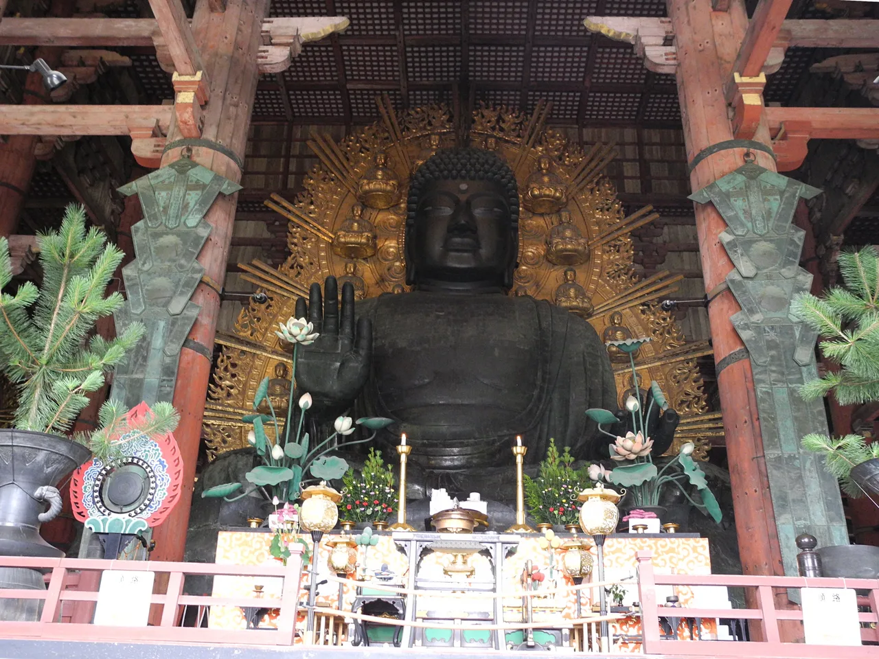 Front view of the colossal bronze Great Buddha statue inside the Great Buddha Hall