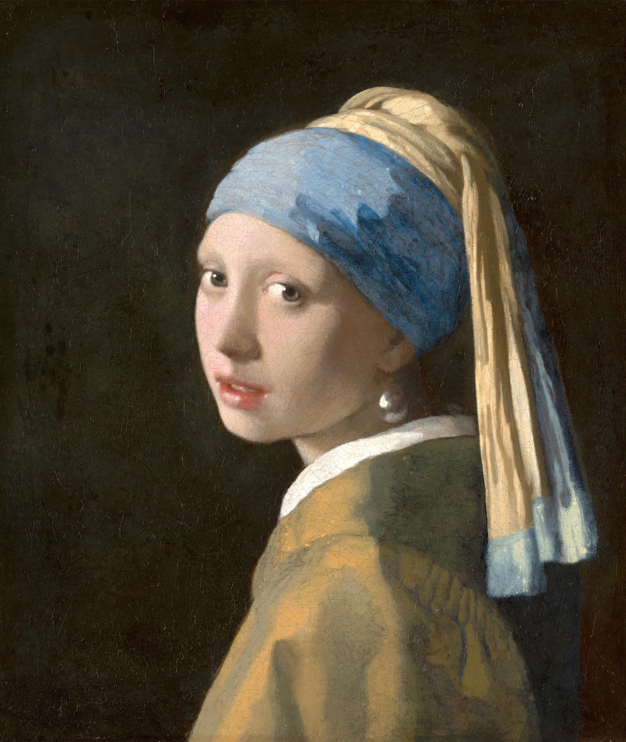 Vermeer's Girl with a Pearl Earring: a young woman in a blue-and-yellow turban against a dark background, her shoulder turned away from the viewer and her mouth slightly open