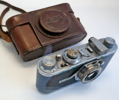Cartier-Bresson's first Leica: a small metal-bodied 35 mm camera displayed in a case