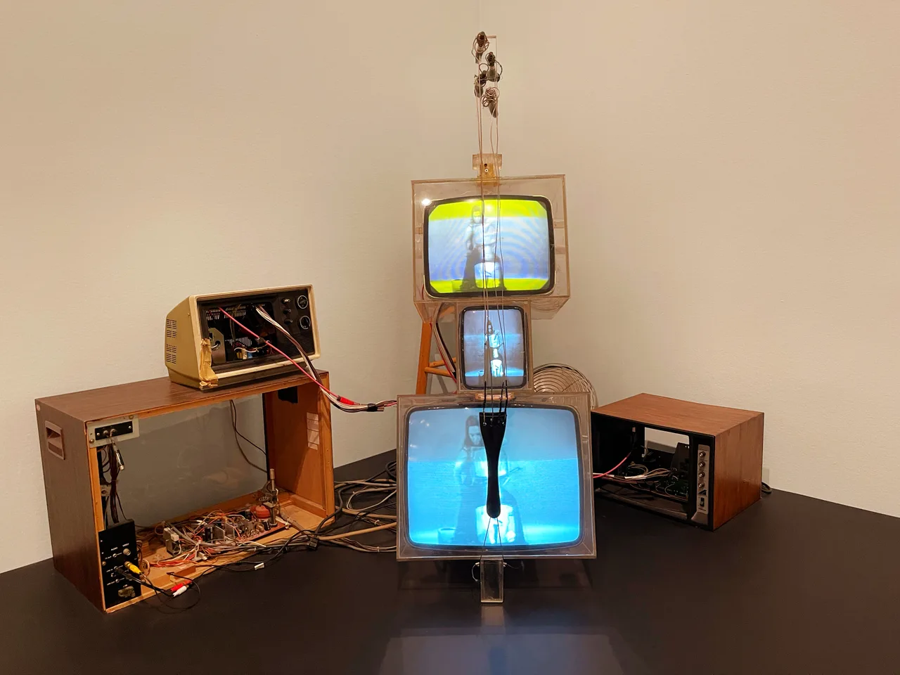 TV Cello: a cello-shaped object built from stacked television cabinets with strings stretched across