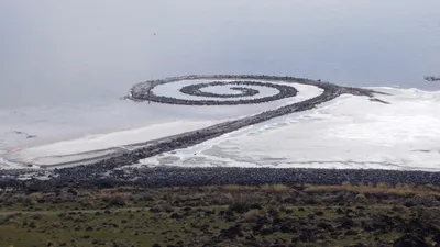 Spiral Jetty: a land art sculpture of stones and earth curling counterclockwise into the reddish waters of the Great Salt Lake