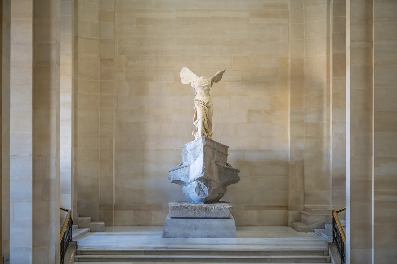 The Winged Victory of Samothrace: a headless statue of the goddess of Victory with open wings and wind-blown drapery, Musée du Louvre
