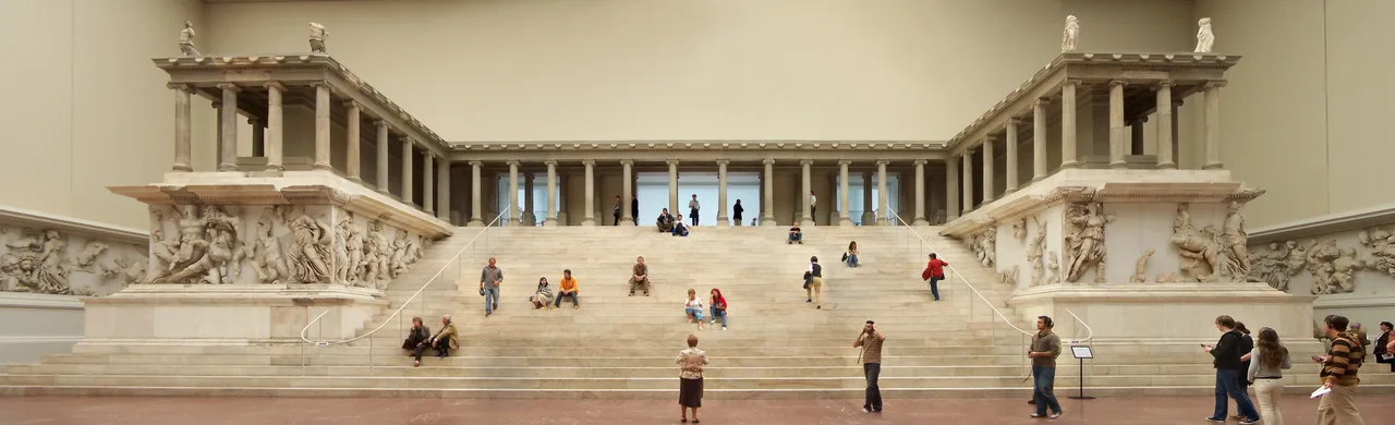 The reconstructed façade of the Pergamon Altar at the Pergamonmuseum in Berlin: a broad staircase rising to a colonnaded upper structure