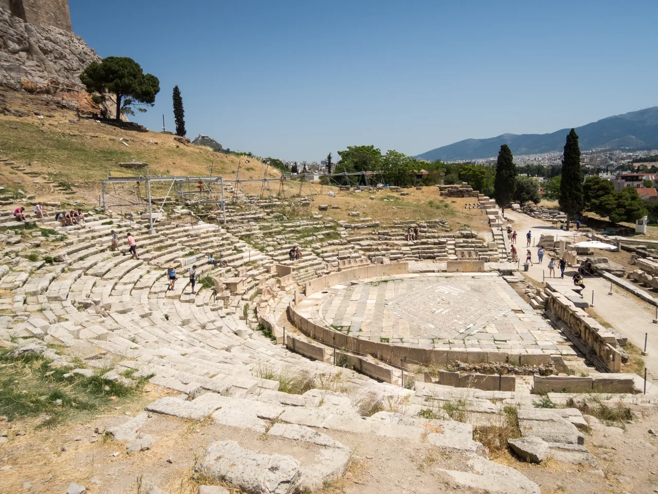 Aerial view of the Theatre of Dionysus on the southern slope of the Athens Acropolis; the half-circle stone tiers are clearly visible