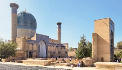 The turquoise dome and entrance iwan of the Gur-e Amir Mausoleum in Samarkand