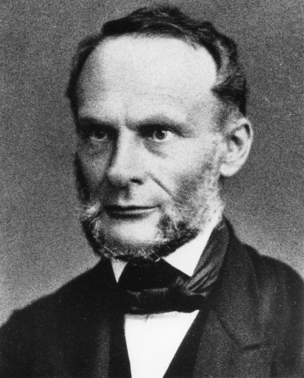 19th-century portrait of Rudolf Clausius: a bearded, dark-coated middle-aged physicist